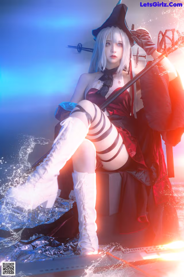 A woman in a pirate costume sitting on top of a boat.
