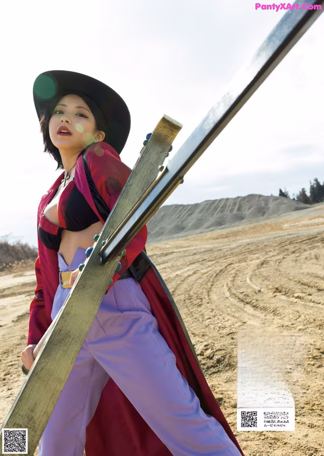 A woman in a red jacket and purple pants holding a sword.